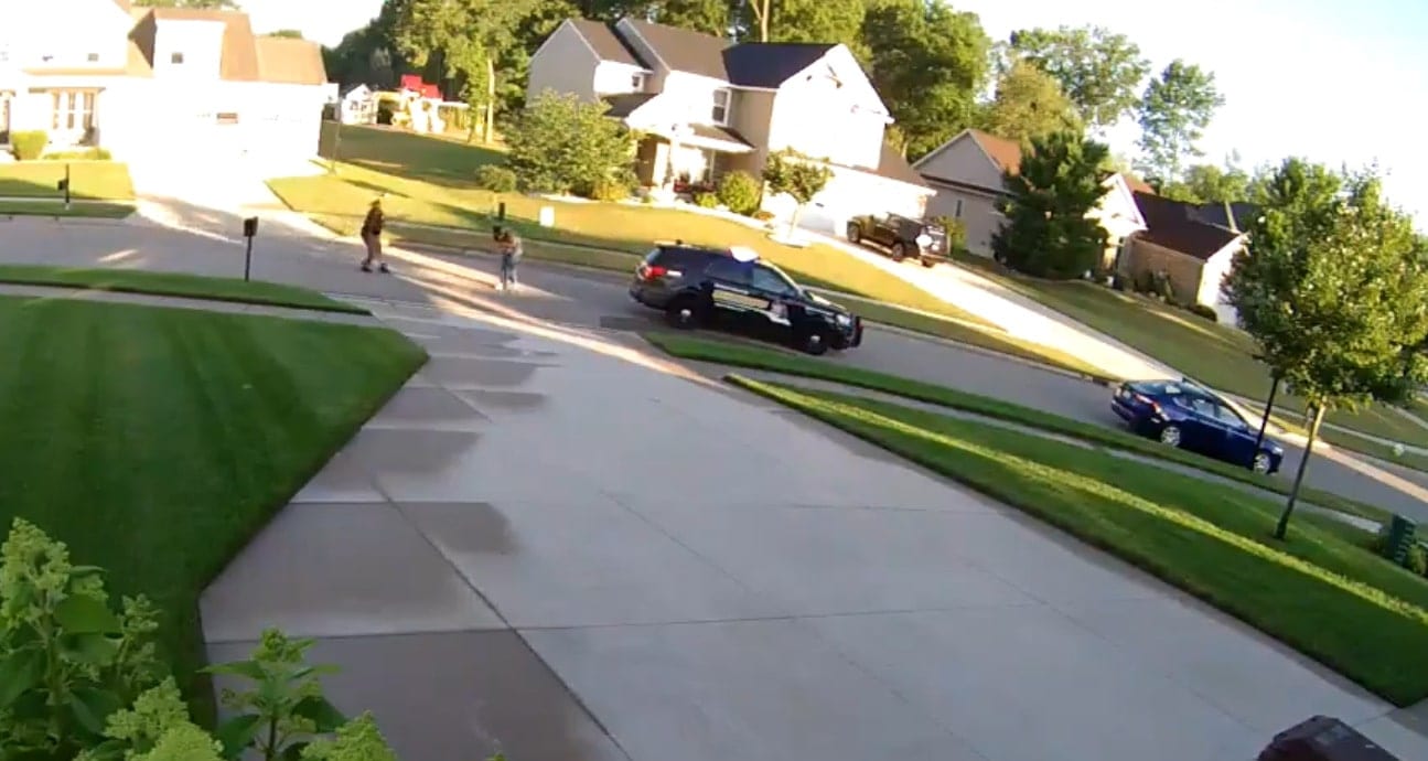 The view from a security cam shows she has backed up several yards.