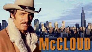 Actor Dennis Weaver dressed as his character 'McCloud'. In the background, the New York City skyline.