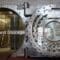 A photo of a giant vault door with the words 'Password Storage'.