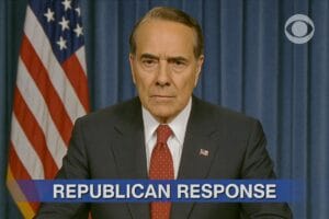 A stern looking Bob Dole in a suit and red tie seated in front of an American flag and blue curtain, with the text REPUBLICAN RESPONSE displayed at the bottom of the image. The CBS logo is in the top right corner.