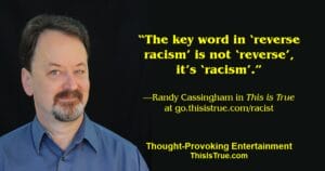 Randy Cassingham, with short dark hair and a goatee, wearing a blue collared shirt, stands against a black background. Beside him is his quote about racism by in yellow text.