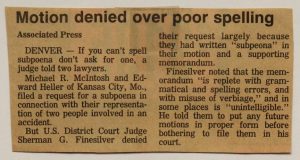A yellowed newspaper clipping with the headline 'Motion denied over poor spelling'. The article explains that a judge rejected a subpoena due to misspellings and unclear language in a memorandum written by two lawyers.