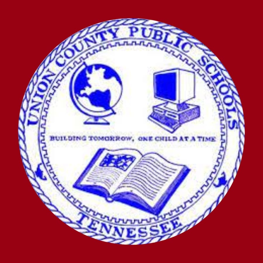 A very blurry seal for Union County Public Schools, Tennessee, "Building Tomorrow, One Child At a Time". It depicts a globe on a stand, a PC with two built-in floppy drives and a CRT monitor, and an open book. It's all bright blue on a white background, surrounded by a deep red field.