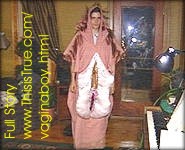 A very tiny photo of Christian Silbereis dressed up in a pink suit from head to toe that resembles a vagina.