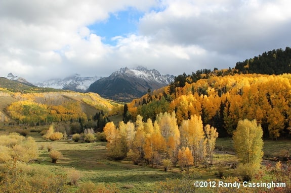 The panorama: meadow, hillsides, and mountain.