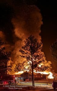 Vertical shot showing a huge cloud of smoke dotted with thousands of burning embers.