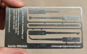 Laser-engraved metal business card for Kevin Mitnick.